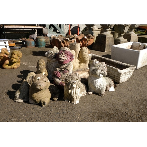 430 - A large assortment of concrete planters, statues and more.