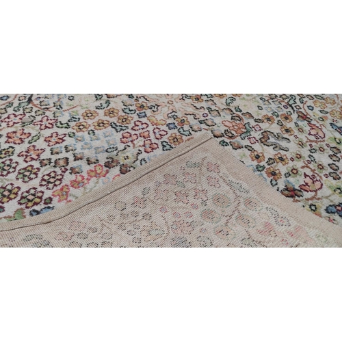 375 - A vintage floral patterned floor rug.