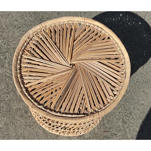 383 - A vintage rattan coffee table/stool.