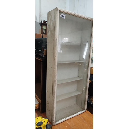 384 - A vintage display cabinet, measuring 15