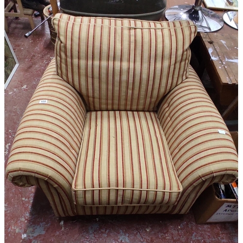 400 - A large armchair in striped upholstery.