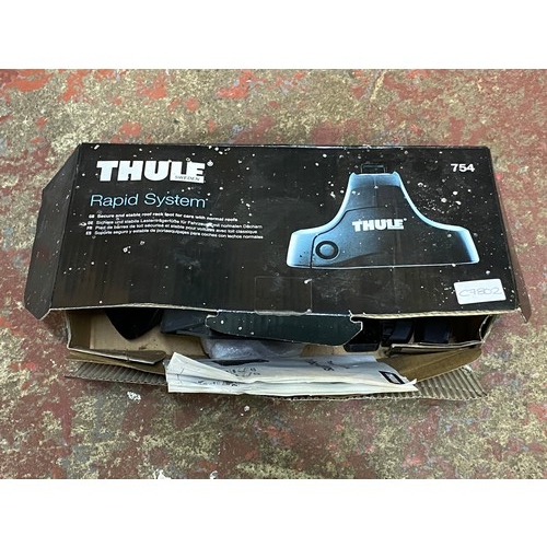 435 - Two sets of Thule car roof racks and attachments.