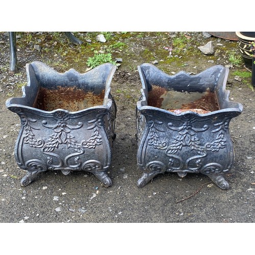 330 - A stunning pair of cast iron planters.