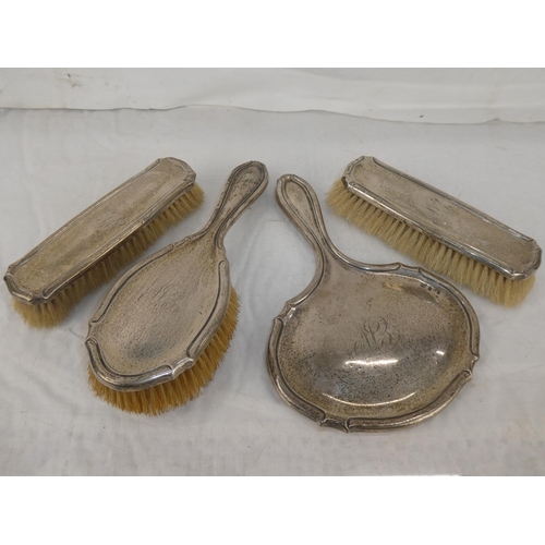 16 - A four piece Sterling Silver dressing table set.