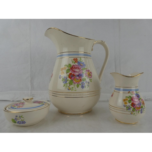 18 - A three piece Flacon Ware floral patterned wash jug set.