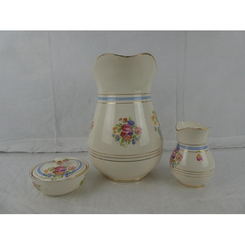 18 - A three piece Flacon Ware floral patterned wash jug set.