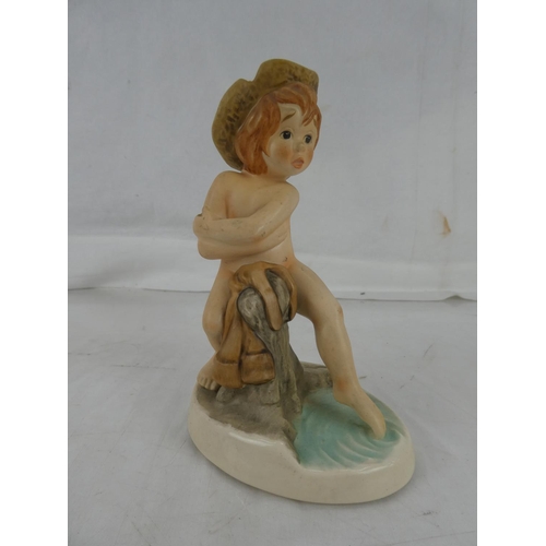 19 - A Goebel figure of a boy.