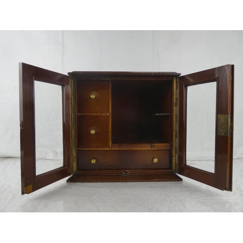 21 - An inlaid mahogany smokers cabinet, measuring 12