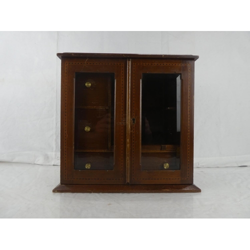 21 - An inlaid mahogany smokers cabinet, measuring 12