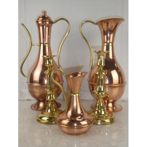 24 - Three vintage copper and brass jugs, measuring 13