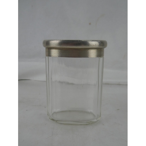 26 - A Sterling Silver topped dressing table jar.