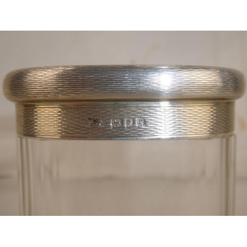 26 - A Sterling Silver topped dressing table jar.