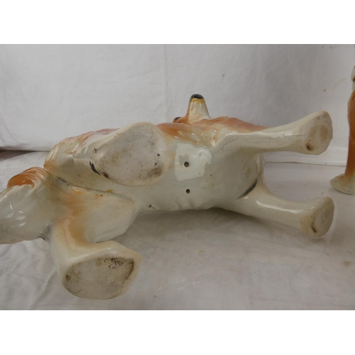 37 - A pair of antique Staffordshire mantle dogs. (a/f)