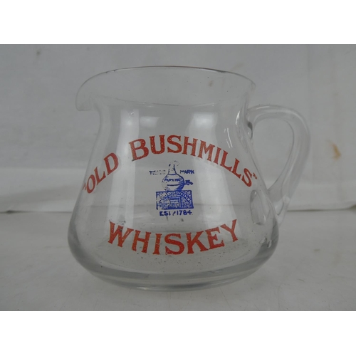 49 - A rare vintage clear glass 'Old Bushmills Whiskey' pub jug.