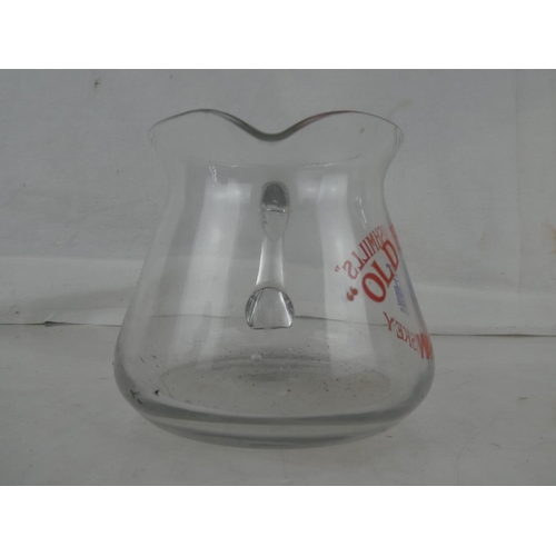 49 - A rare vintage clear glass 'Old Bushmills Whiskey' pub jug.