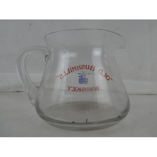 49 - A rare vintage clear glass 'Old Bushmills Whiskey' pub jug.