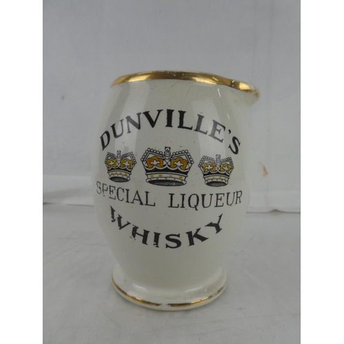 58 - A vintage J A Campbell, Belfast 'Dunville's VR Whisky - Ask For It and See You Get It' pub jug (a/f)... 