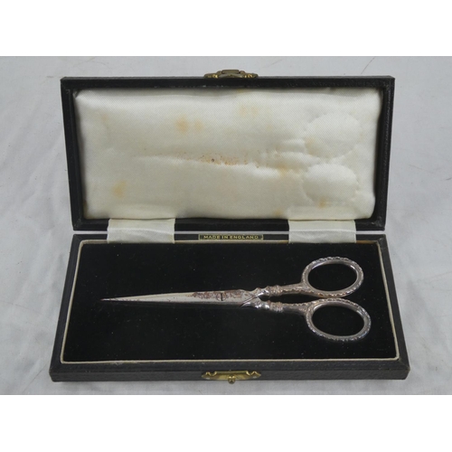 70 - A cased pair of Sterling Silver handled scissors presented to Mrs E C Stevenson by Gold Springs of C... 