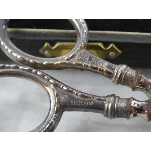 70 - A cased pair of Sterling Silver handled scissors presented to Mrs E C Stevenson by Gold Springs of C... 