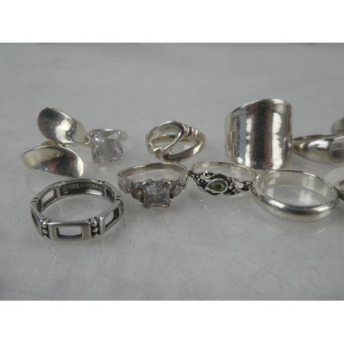 77 - A large collection of Sterling Silver rings.