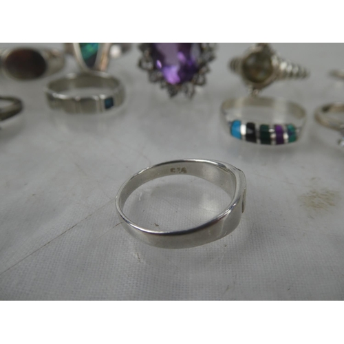 77 - A large collection of Sterling Silver rings.