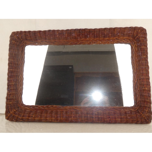 5 - A vintage wicker framed wall mirror, measuring 29