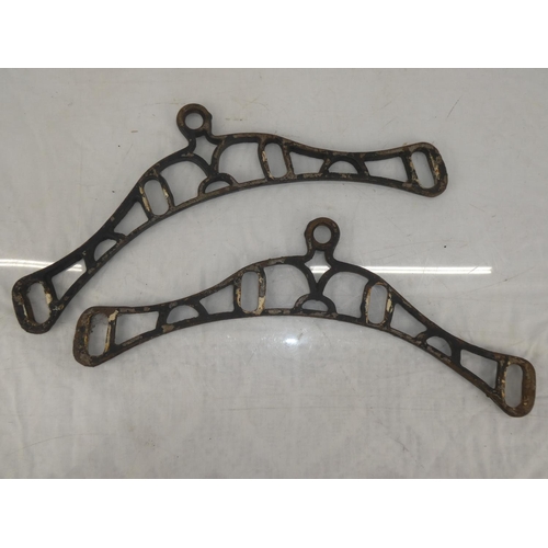 9 - A pair of antique clothes hanger brackets.