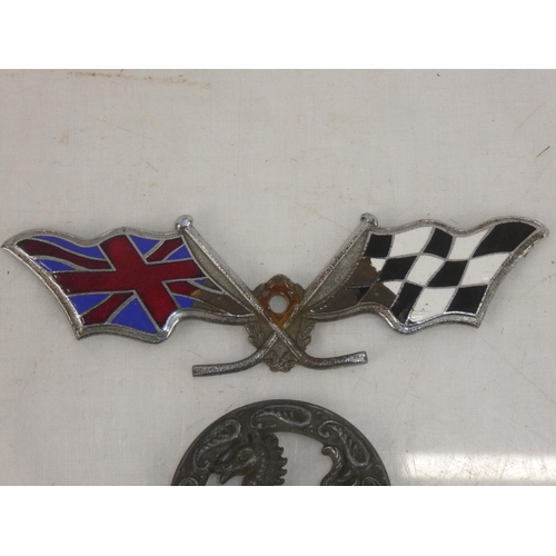 101 - A vintage enamel racing car emblem & antique style medal.