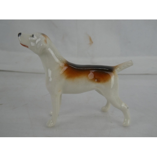 117 - A Beswick Hound dog (a/f) and three others.