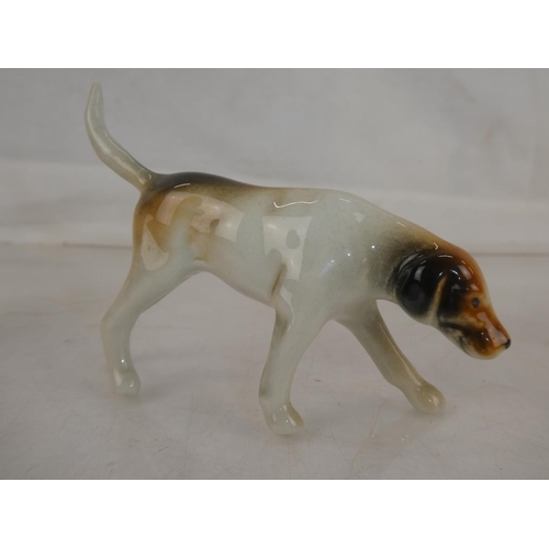 117 - A Beswick Hound dog (a/f) and three others.