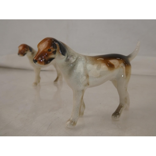 117 - A Beswick Hound dog (a/f) and three others.