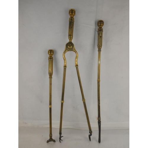 119 - A set of three solid brass fire irons.