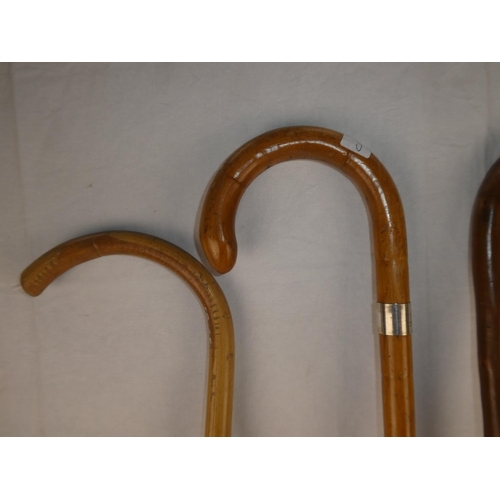 121 - Four vintage walking canes.