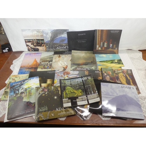 127 - A large collection of Adams Irish Art auction catalogues.