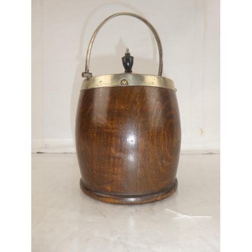 128 - A vintage oak biscuit barrel.