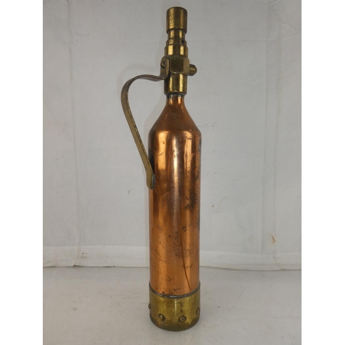 143 - A vintage brass and copper fire extinguisher, measuring 17