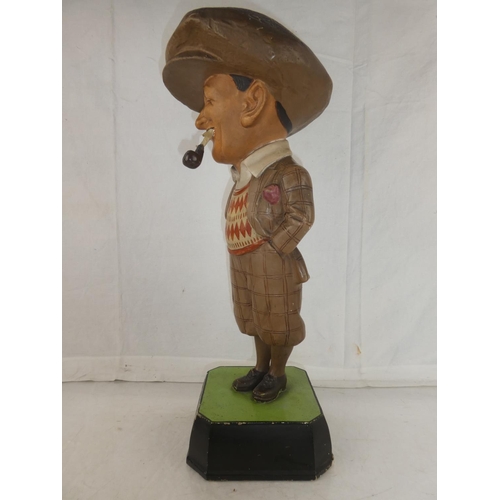 145 - A rare Bromford Man advertising golfing figure complete with pipe and mounted on original square bas... 