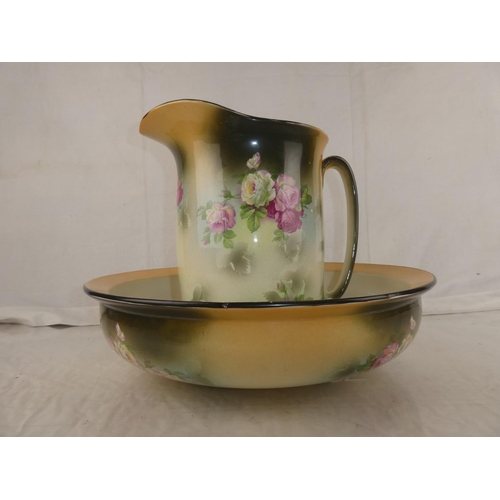 149 - An antique L & Son Ltd wash jug and bowl decorated with flowers.