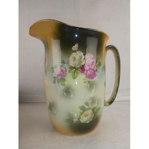 149 - An antique L & Son Ltd wash jug and bowl decorated with flowers.