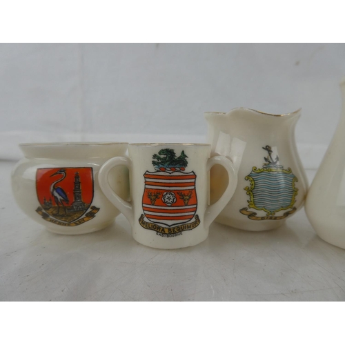 90 - Eight pieces of Goss crested ware.