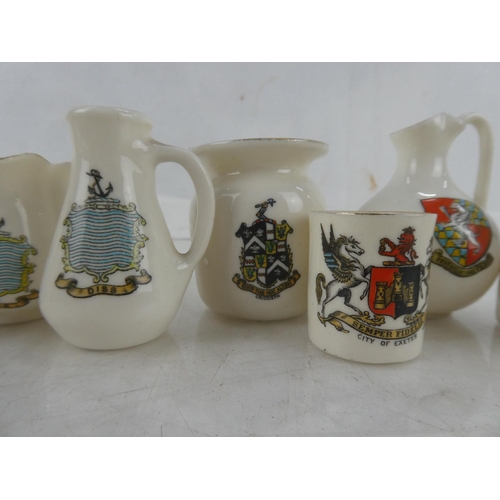 90 - Eight pieces of Goss crested ware.