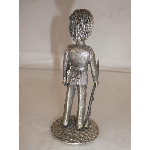 160 - A metal Meccano figure of a Grenadier Guardsman, measuring 11cm.