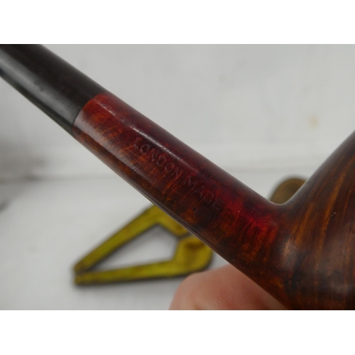 164 - A collection of antique pipes and their leather cases to include Brilon number 6 Swedish pipe.