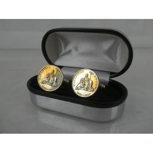 166 - A pair of Sterling silver 'National Service' cufflinks.