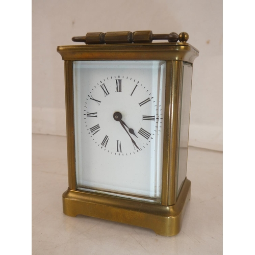 171 - An antique brass carriage clock, measuring 10.5cm.