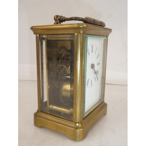 171 - An antique brass carriage clock, measuring 10.5cm.