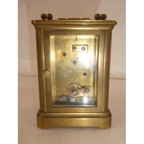 171 - An antique brass carriage clock, measuring 10.5cm.