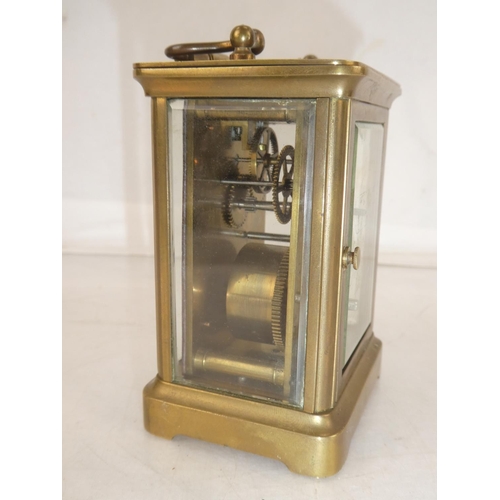 171 - An antique brass carriage clock, measuring 10.5cm.