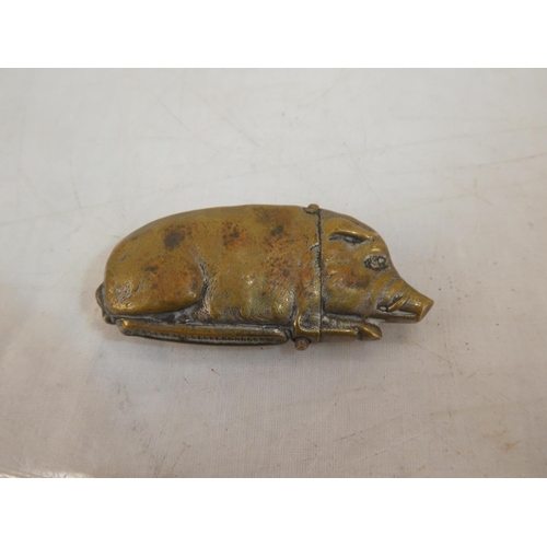 172 - An unusual antique novelty brass vesta case, modelled as a pig.