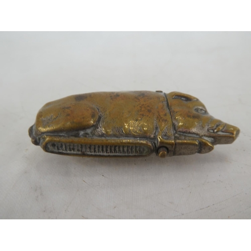 172 - An unusual antique novelty brass vesta case, modelled as a pig.